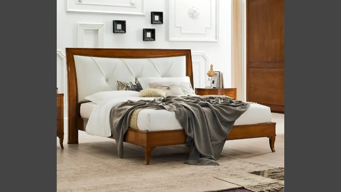 Letto Aurora in legno con testiera in pelle di Le Fablier